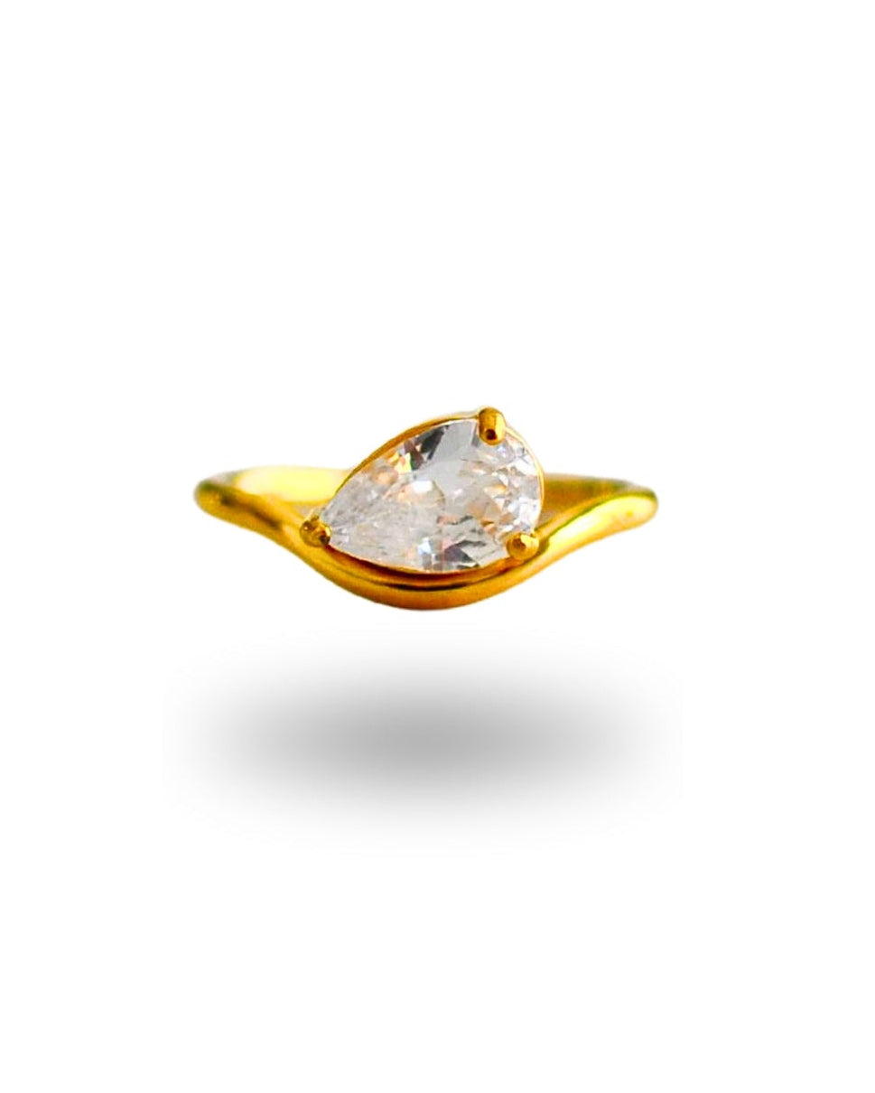 Gold earring with a clear gemstone on a white background