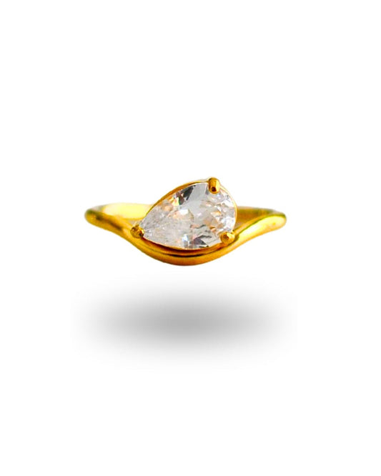 Gold earring with a clear gemstone on a white background