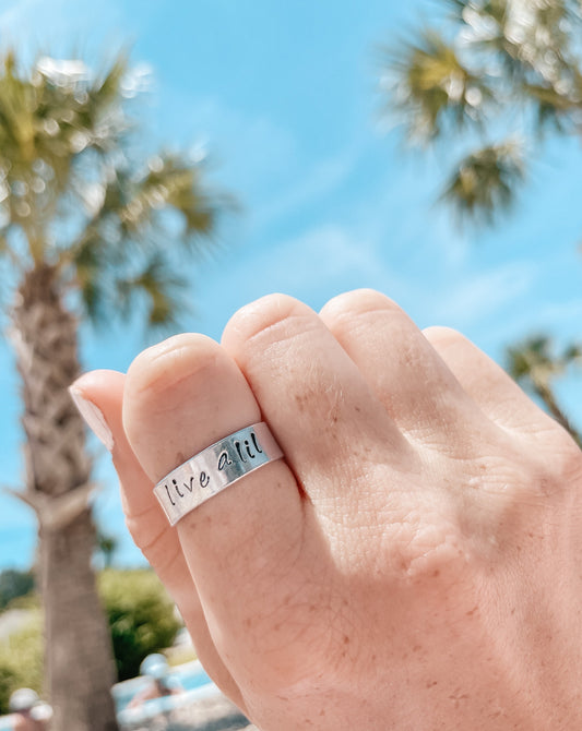 live a lil stamped ring